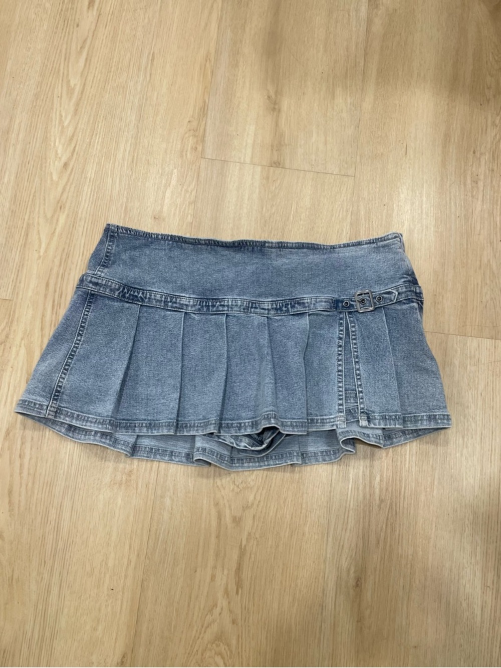 BDG light blue denim pleated mini skort with buckle detail. Size: L